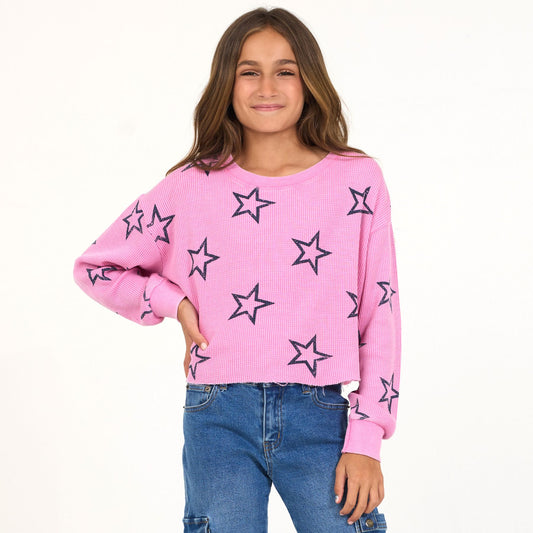 Girl in pink star crew shirt