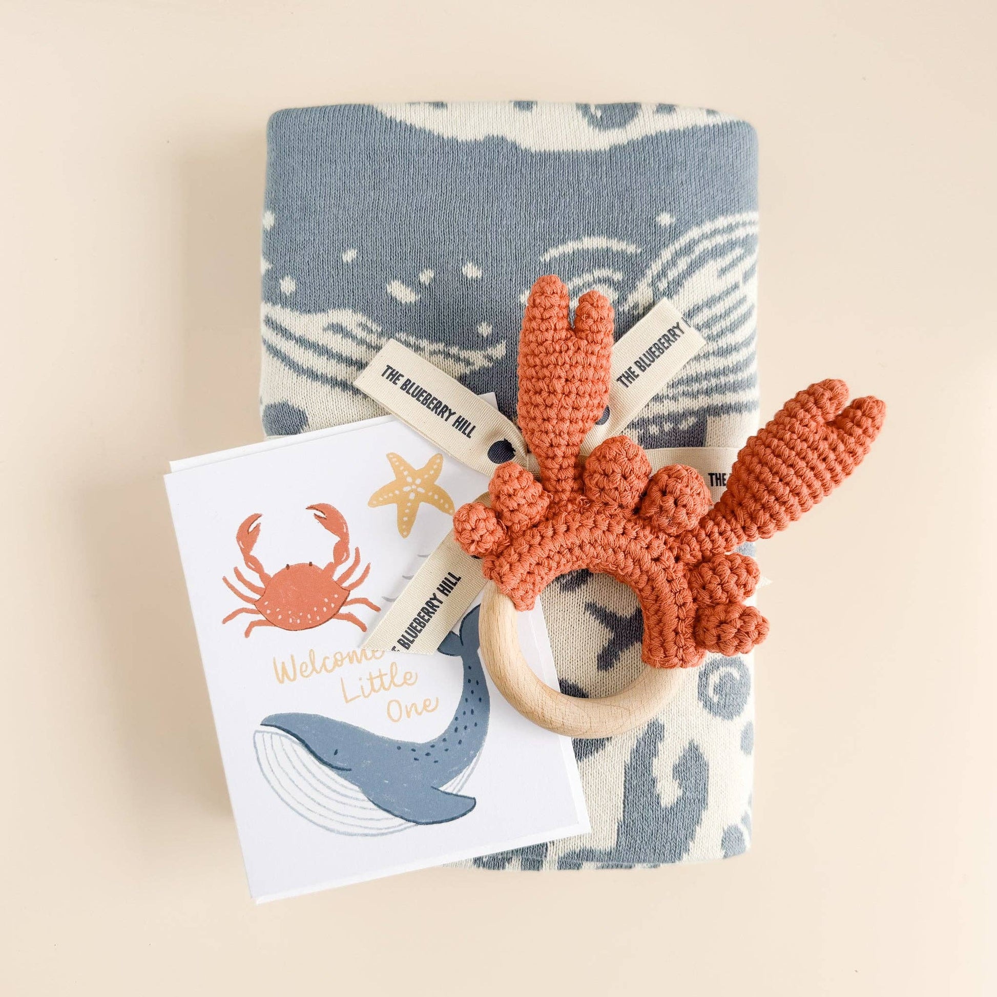 sweet nautical greeting card, welcome little one with blanket and teether