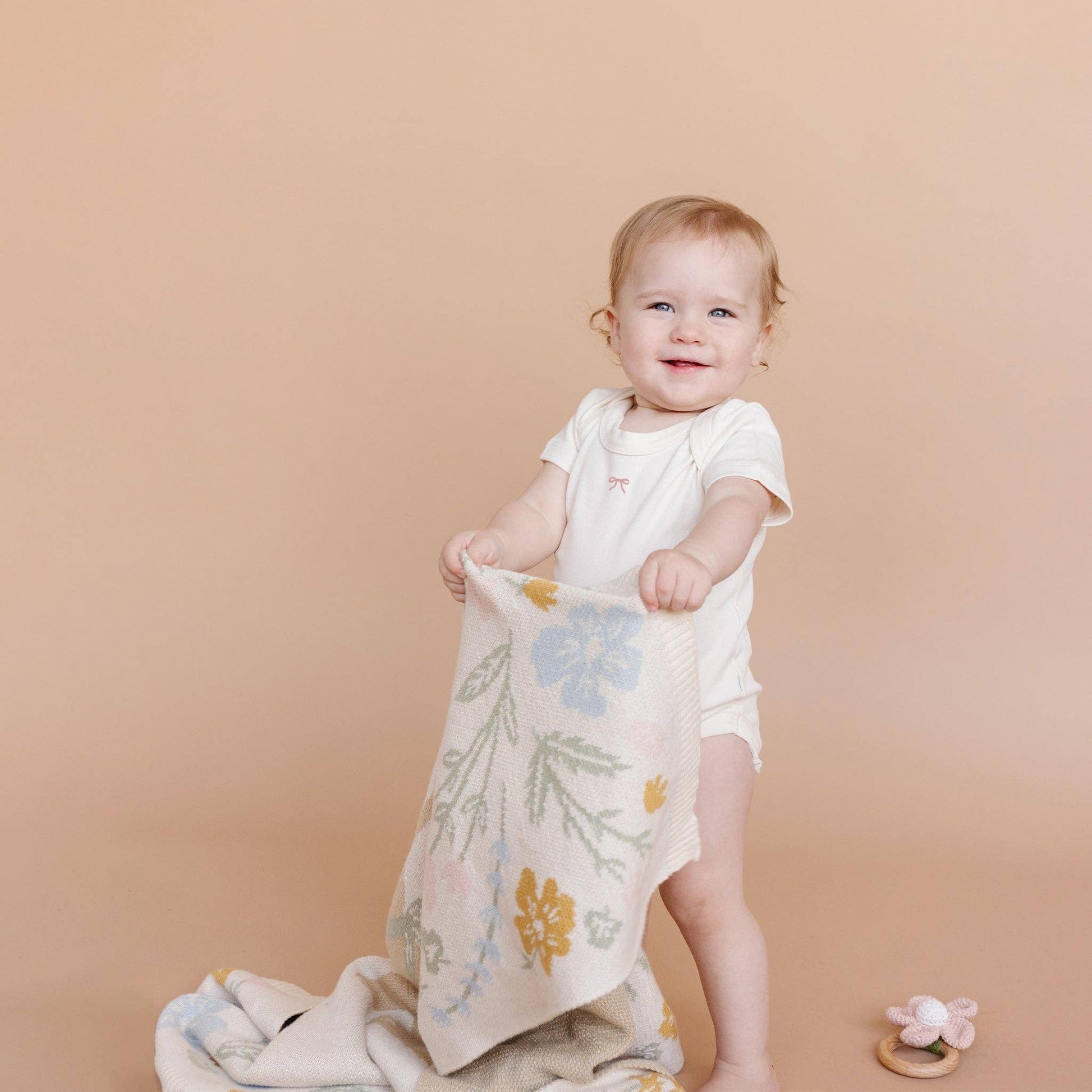 baby with pastel bunny blanket 