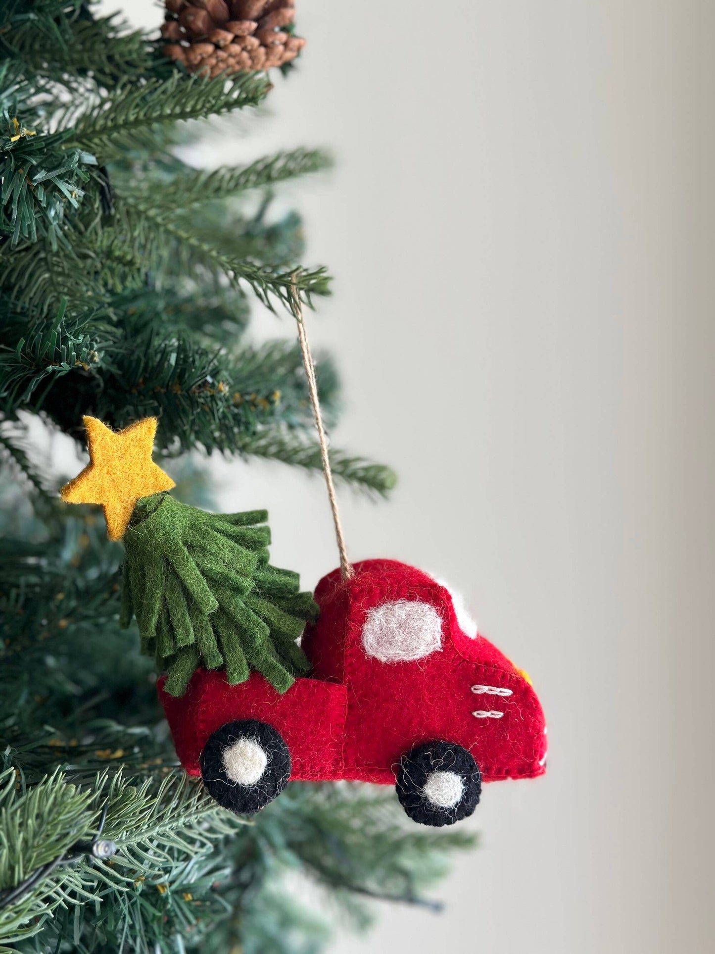 Red truck with tree and star ornament