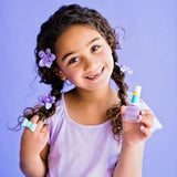 girl in purple holding lilac nail polish 