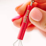 hand holding an earring back tool 
