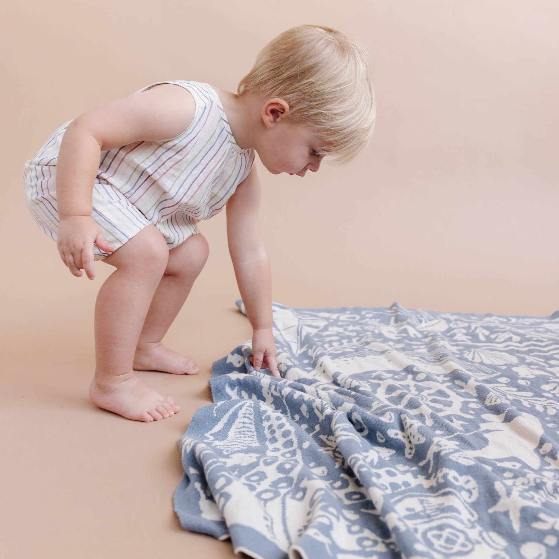 baby with nautical blanket