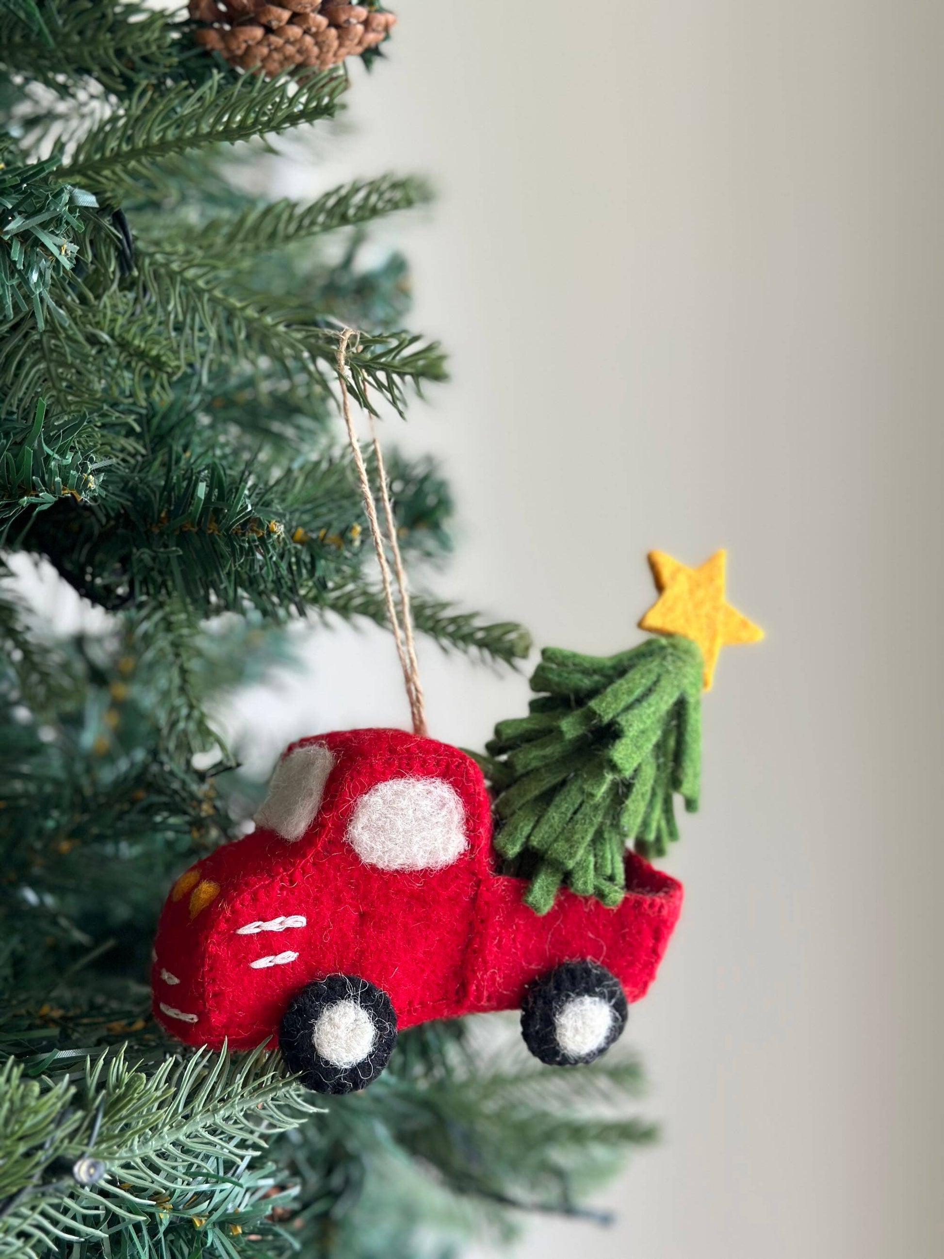 Red truck with tree and star ornament