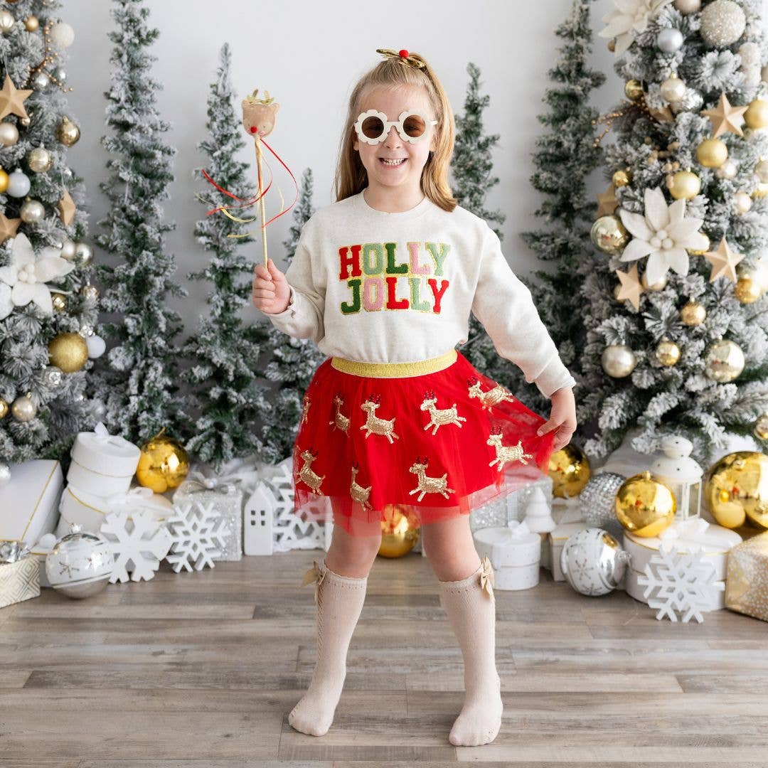 Girl wearing Red tutu with gold sequin reindeer