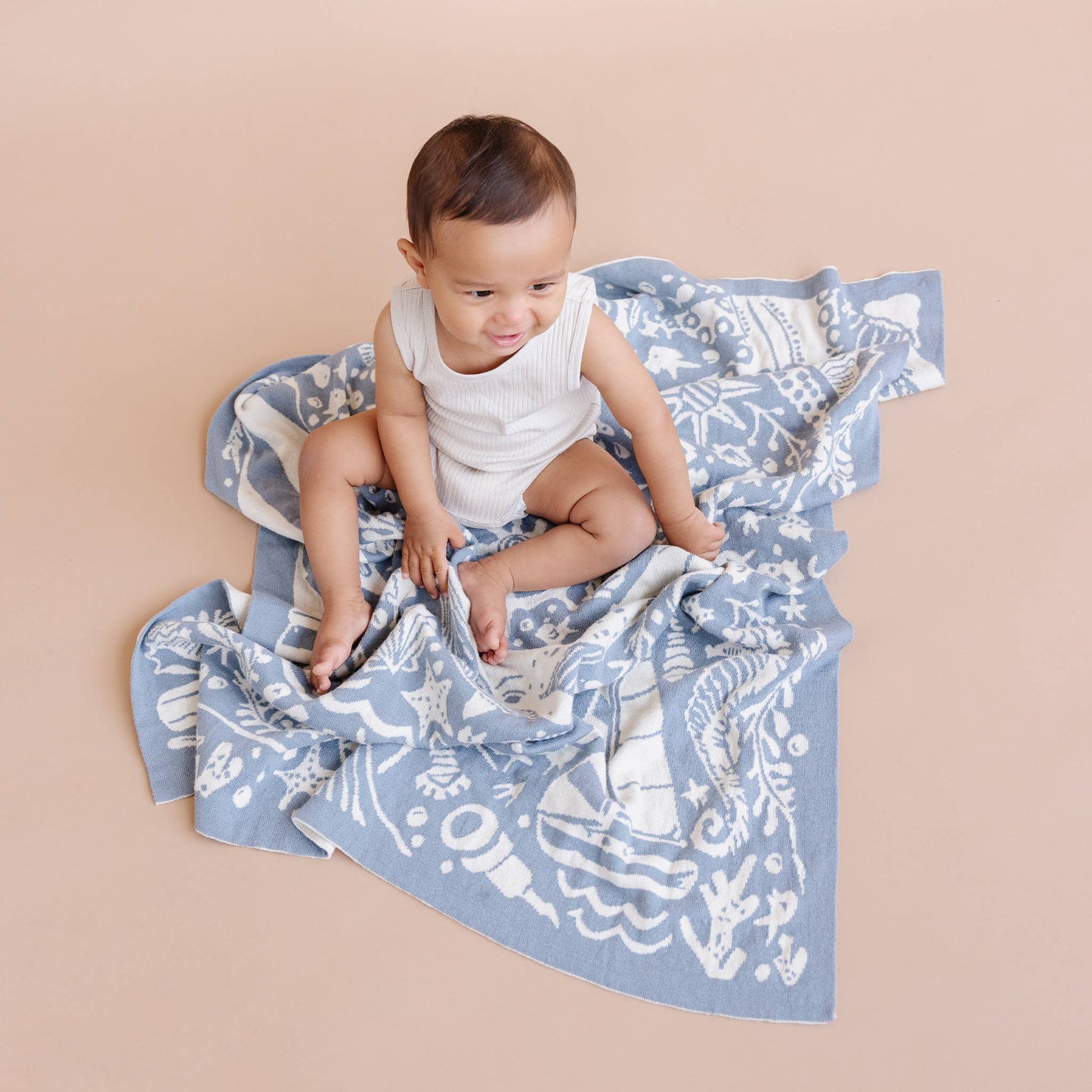 baby with nautical blanket