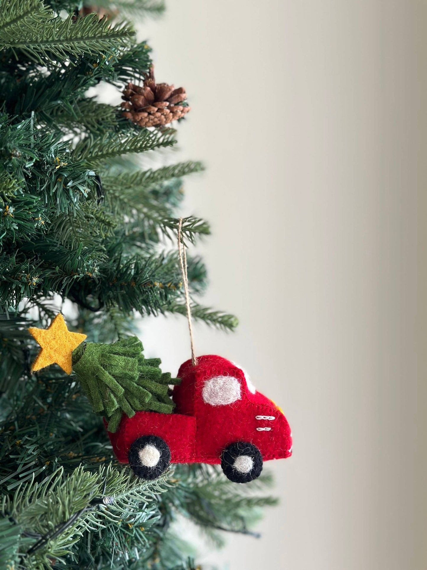 Red truck with tree and star ornament