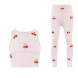 Pink children's tank top and leggings set with cherry pattern on a white background