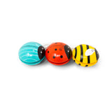 Three colorful bug-shaped yo-yos on a white background