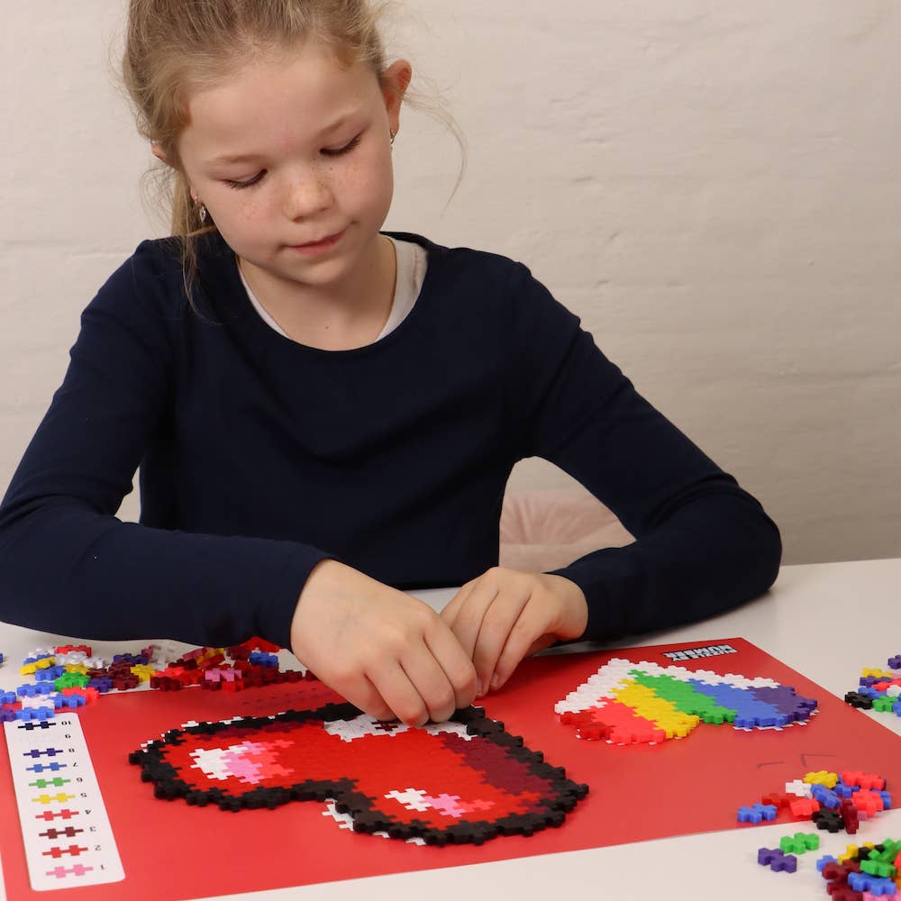 Girl doing heart puzzle