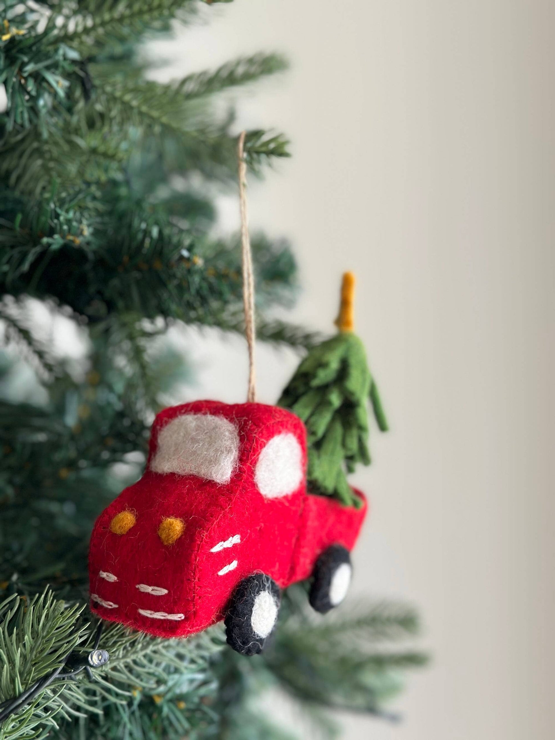 Red truck with tree and star ornament