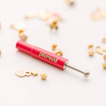 earring back tool  and white background
