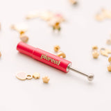 earring back tool  and white background
