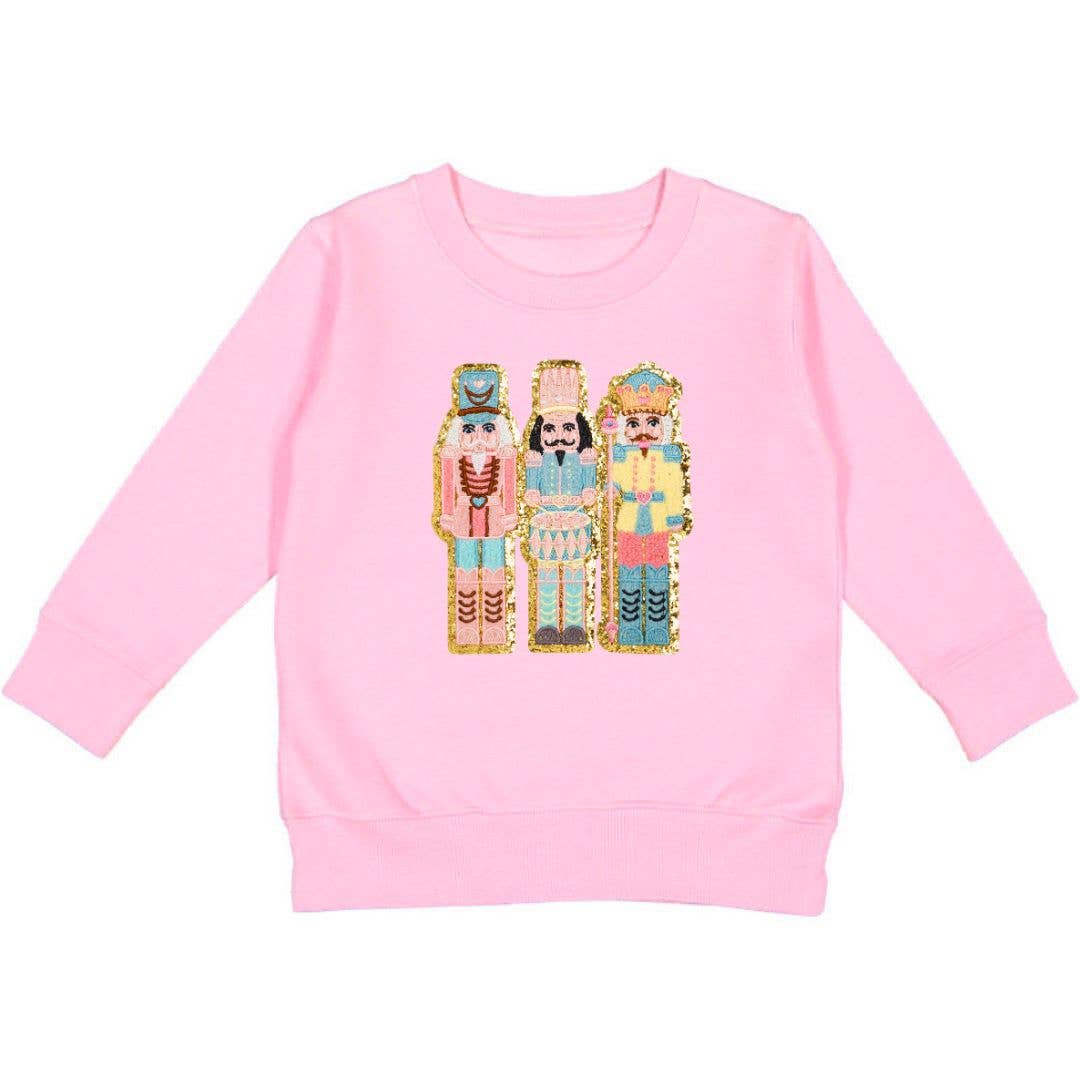 Pink sweatshirt with nutcracker patch