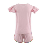 Pink set with ruffled sleeves on a white background