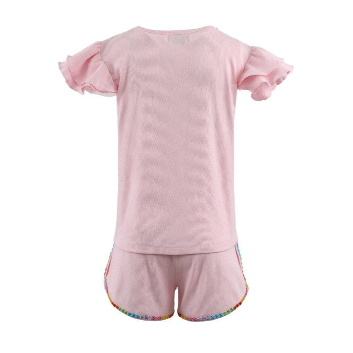 Pink set with ruffled sleeves on a white background