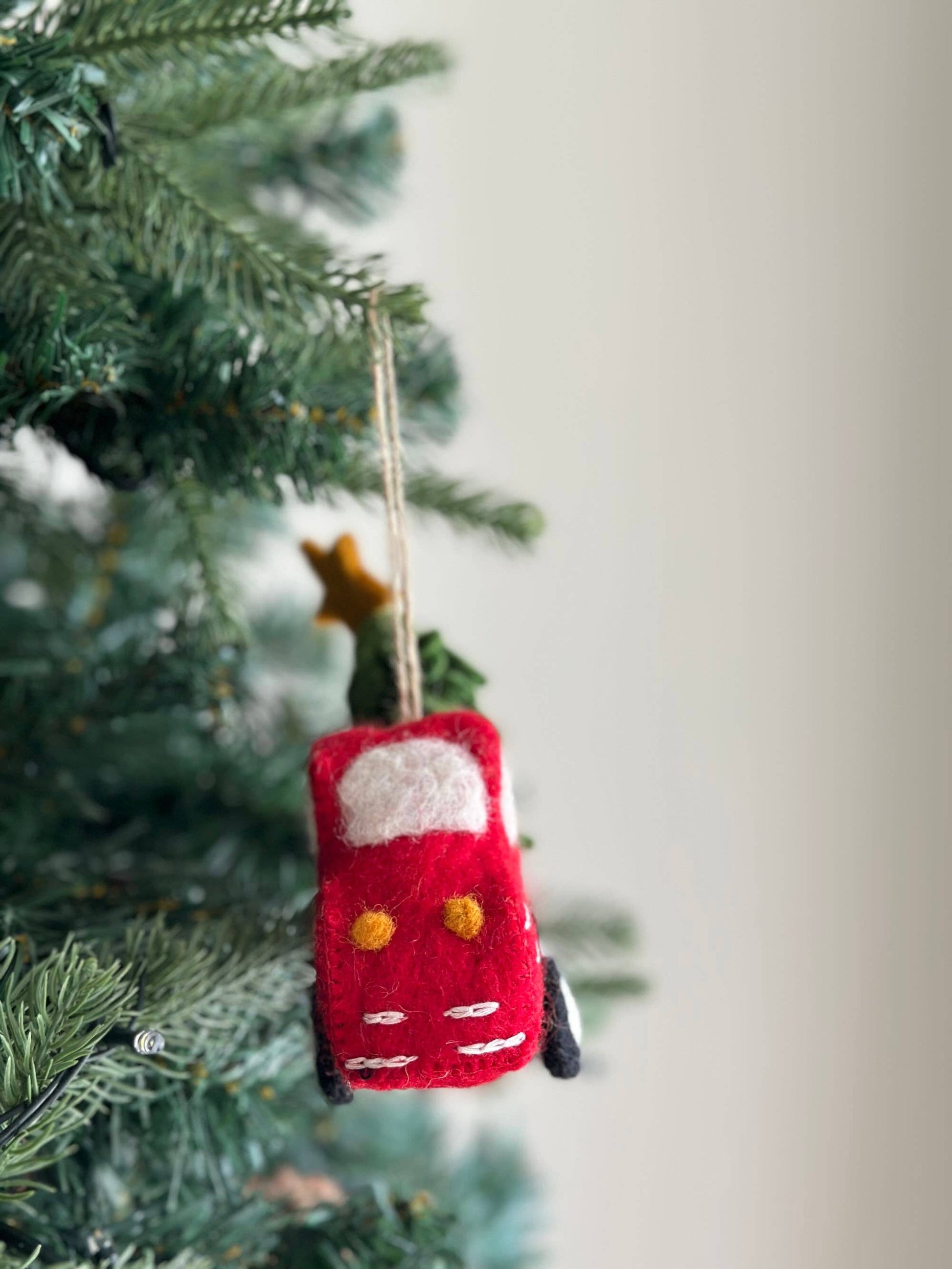 Red truck with tree and star ornament