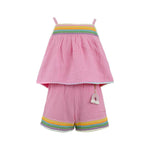 Pink children's outfit with rainbow trim on a white background
