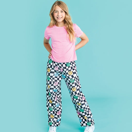 girl wearing happy times plush pants