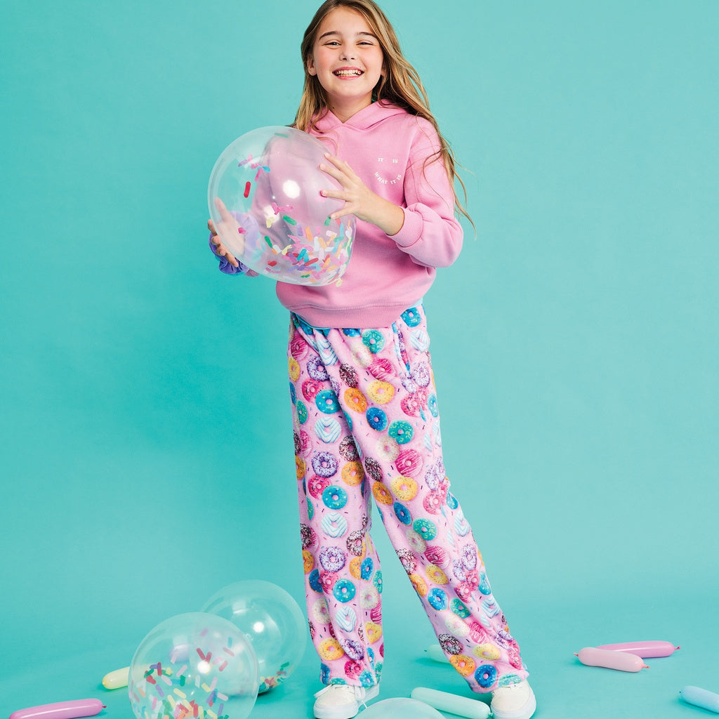 girl wearing the donut plush pants