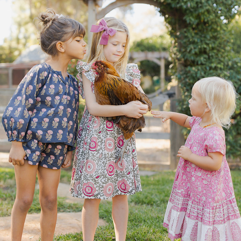 3 girls wearing dresses and ava floral top 