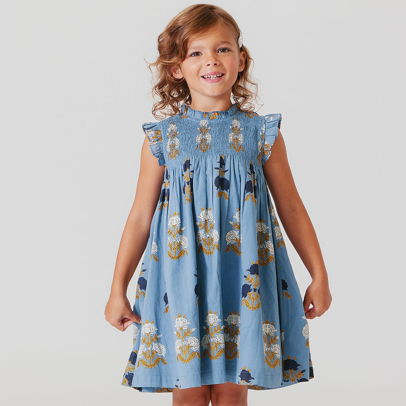 girl wearing Stevie Dress in blue flowerette 