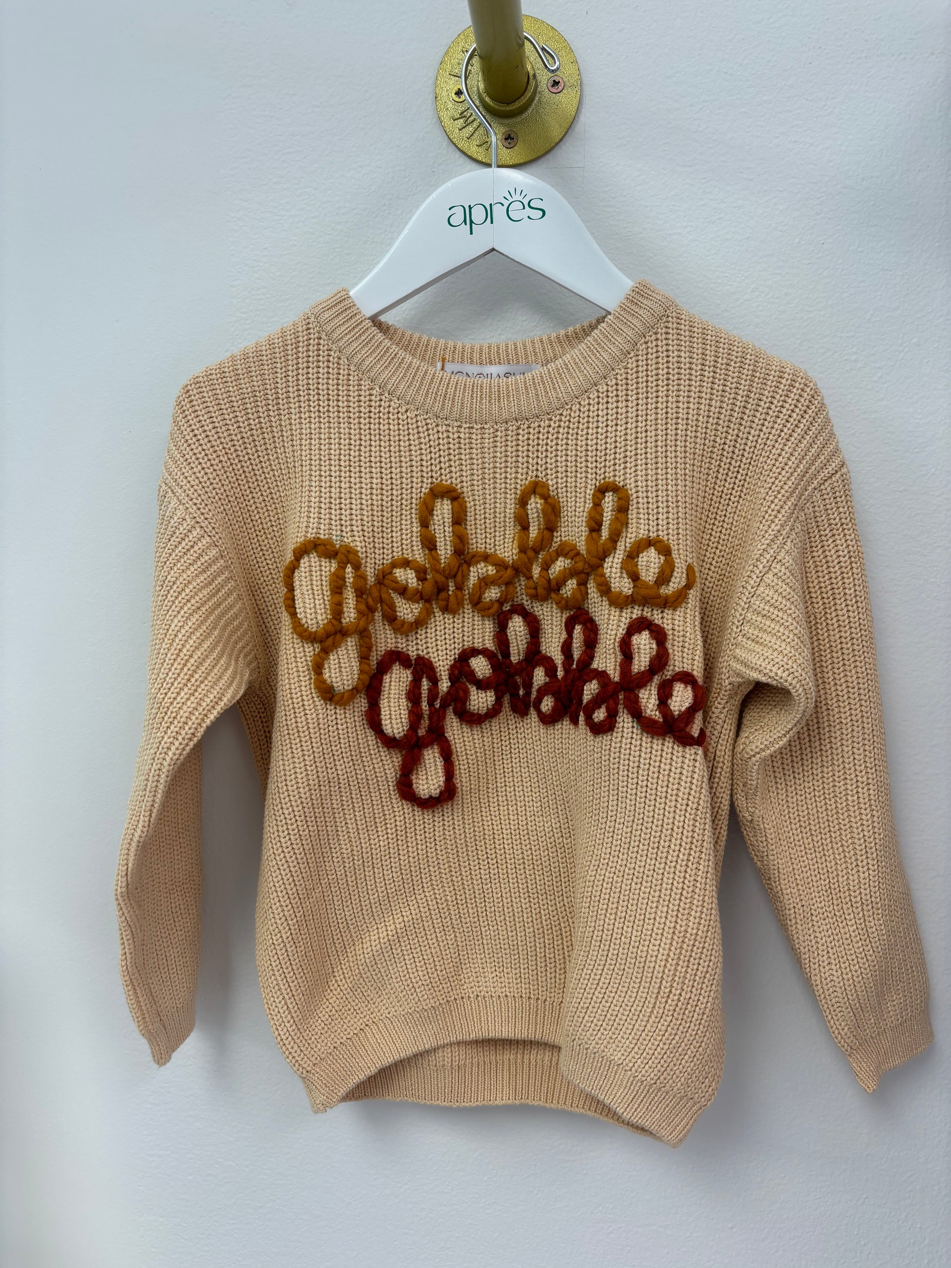 Cream sweater with Gobble Gobble written in script