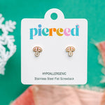 Mushroom-shaped earrings on a 'pierced' branded card with a green background