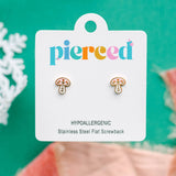 Mushroom-shaped earrings on a 'pierced' branded card with a green background