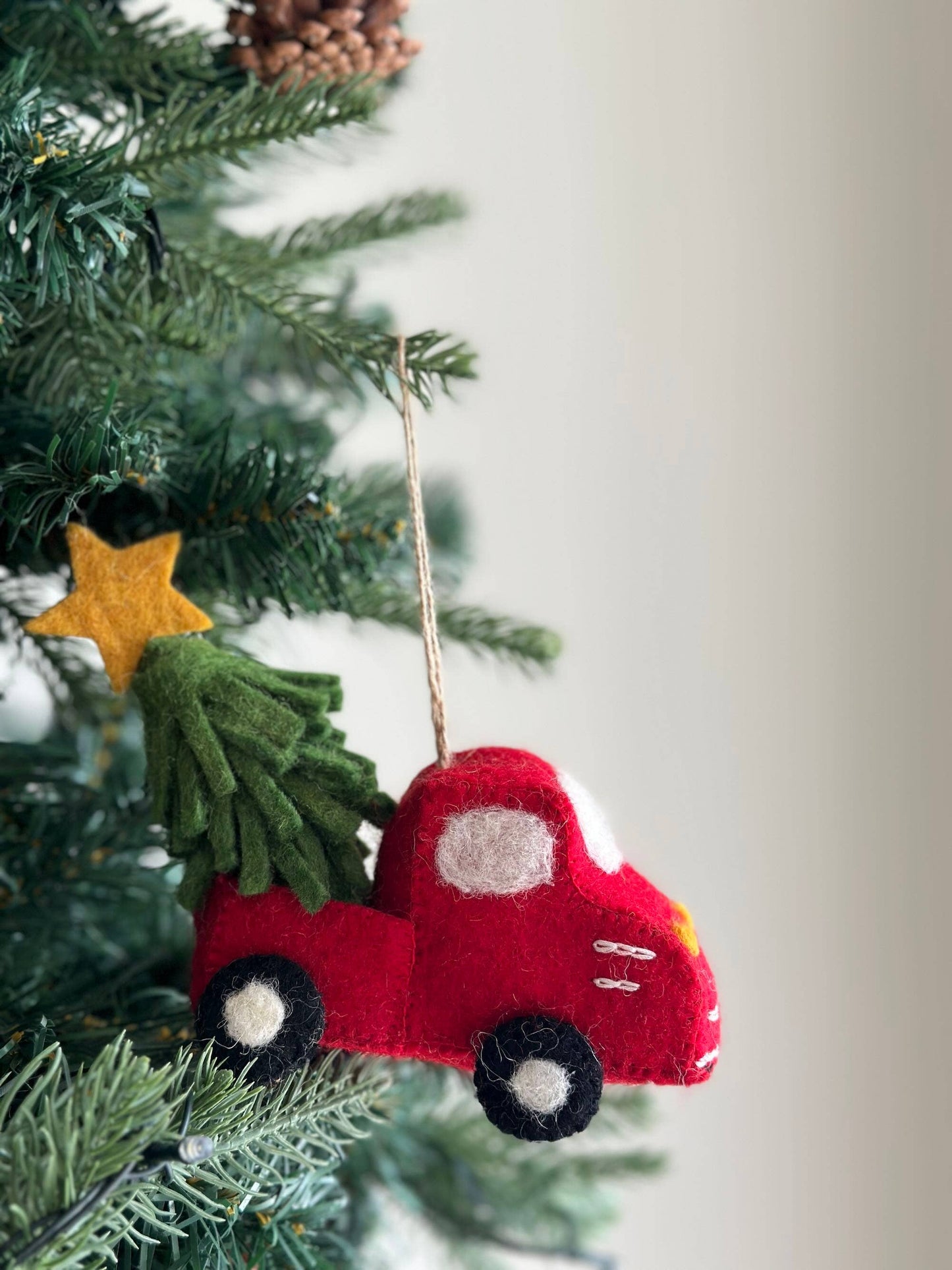 Red truck with tree and star ornament