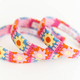 3 Colorful flower-patterned headbands on a white background