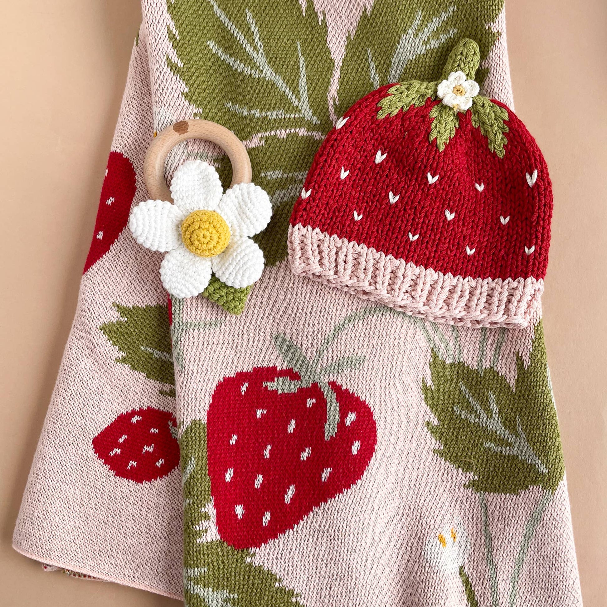 flower rattle and hat with strawberry blanket 