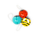 Three colorful yo-yos shaped like ladybug, bee, and beatle on a white background