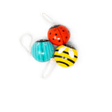 Three colorful yo-yos shaped like ladybug, bee, and beatle on a white background