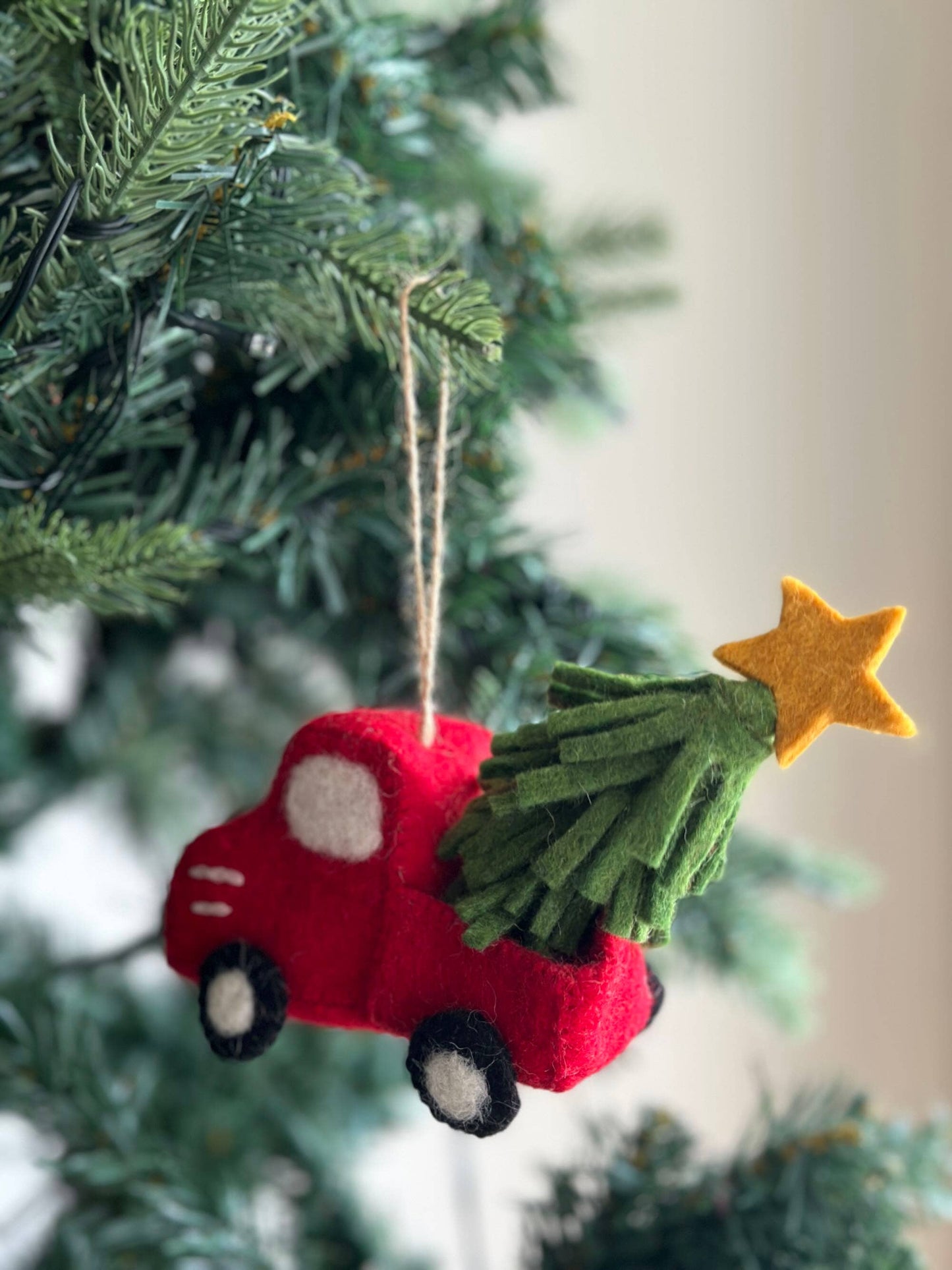 Red truck with tree and star ornament