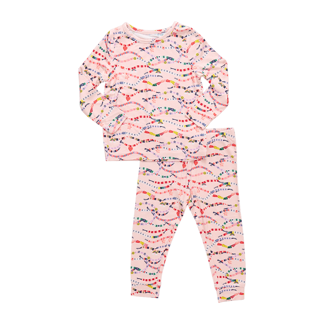 light pink long sleeved pajama set with colorful friendship bracelets