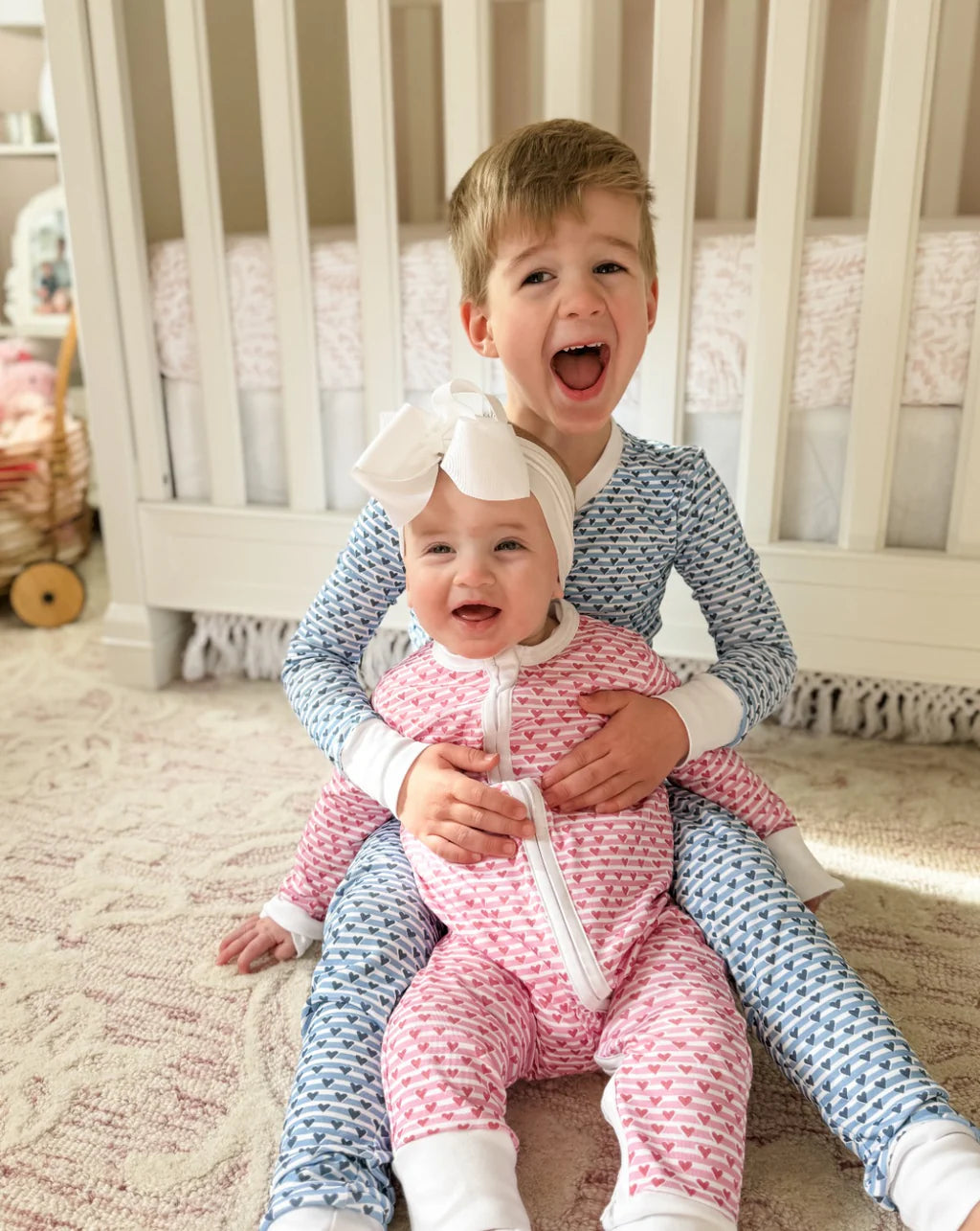 Boy and Baby Girl Wearing Sailor Heart PJs