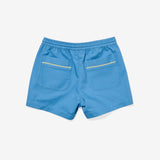  back of Blue shorts with yellow zippers on a light gray background